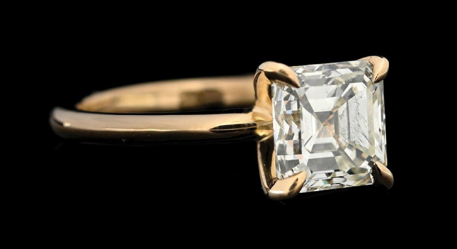 14K YELLOW GOLD 2.38CT EMERALD CUT DIAMOND SOLITAIRE RING W/GIA REPORT: 14k yellow gold diamond solitaire engagement ring set with 1 emerald cut natural diamond weighing 2.38cts, graded M color, VS1 clarity. Ring is accompanied by an original GIA diamond grading report. (