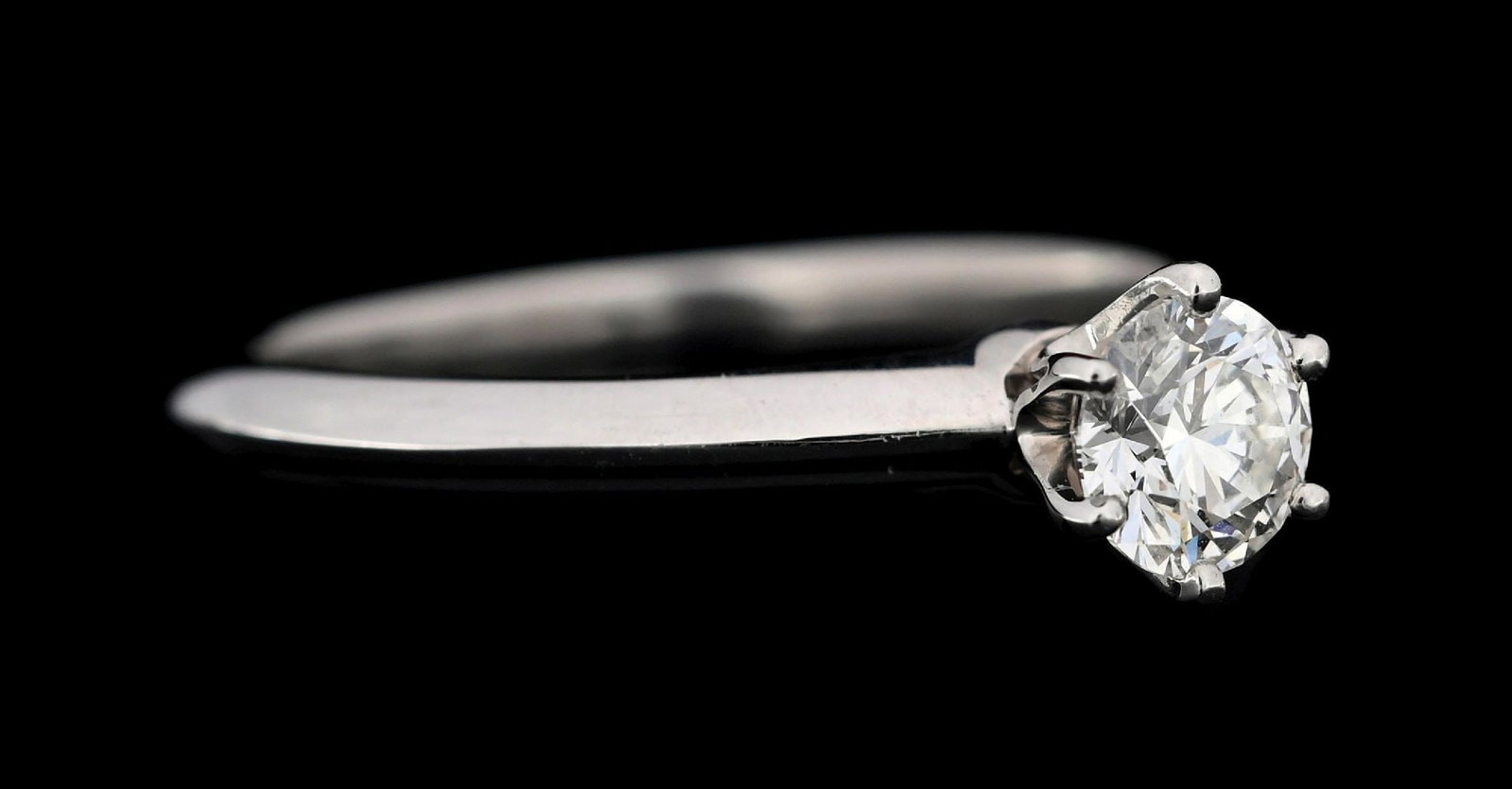 PLATINUM TIFFANY & CO DIAMOND SOLITARE ENGAGEMENT RING W/BOX & CERTIFICATE: Platinum Tiffany & Co. diamond solitaire engagement ring set with 1 round brilliant cut natural diamond weighing 0.45cts, graded I color, VS1 clarity, triple-x (excellent). Ring is accompanied by an o