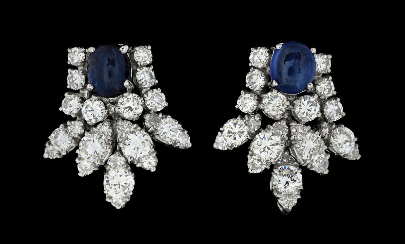 14K WHITE GOLD SAPPHIRE & DIAMOND EARRINGS: 14k white gold sapphire and diamond earrings consisting of 2 oval cabochon blue sapphires with a total weight of 1.20cts and 46 round brilliant cut natural diamonds with a total weight of 3.50cts.