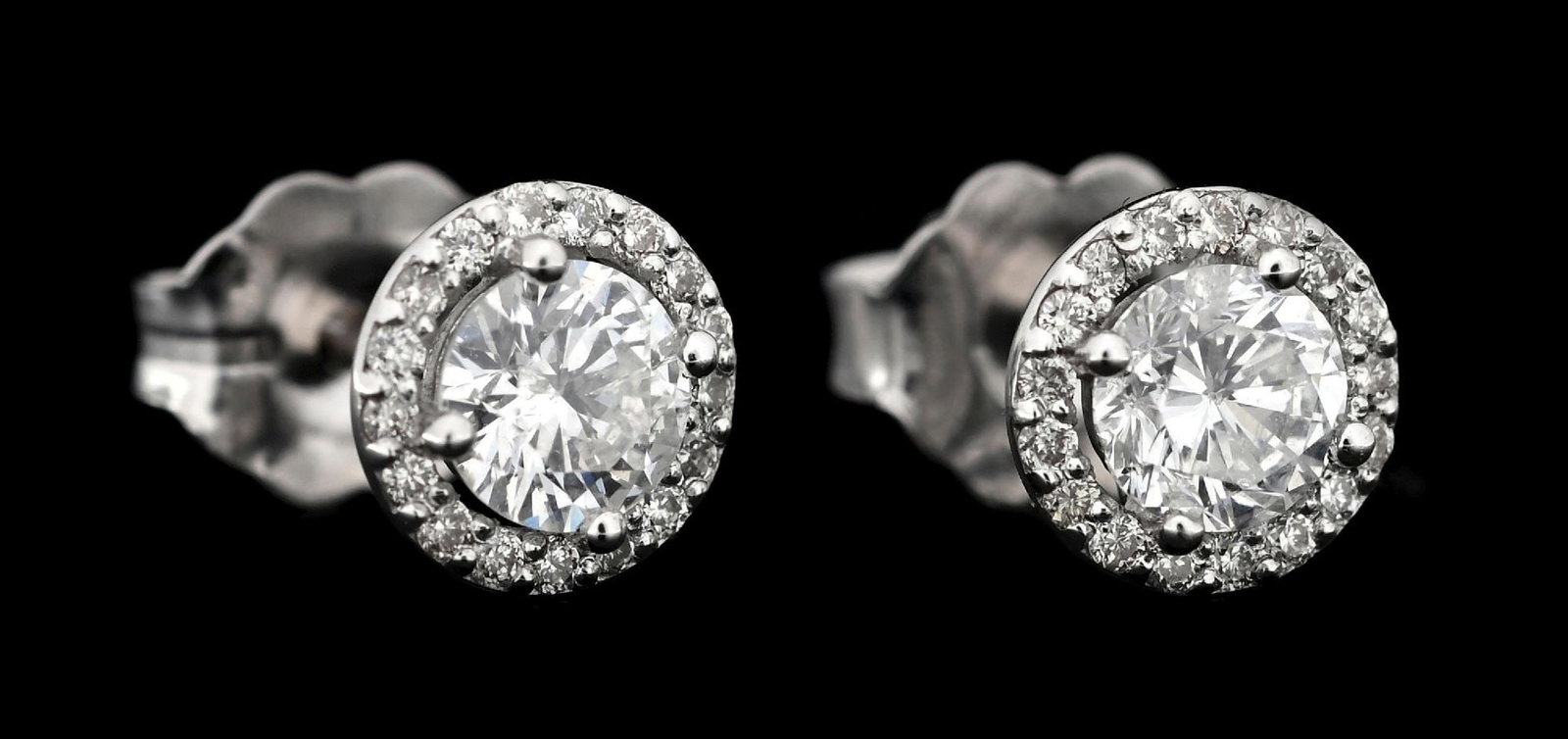 14K WHITE GOLD DIAMOND HALO STUD EARRINGS: 14k white gold diamond halo stud earrings consisting of 2 round brilliant cut natural diamonds with a total weight of 0.50cts and an additional 35 round cut natural diamonds with a total weight of