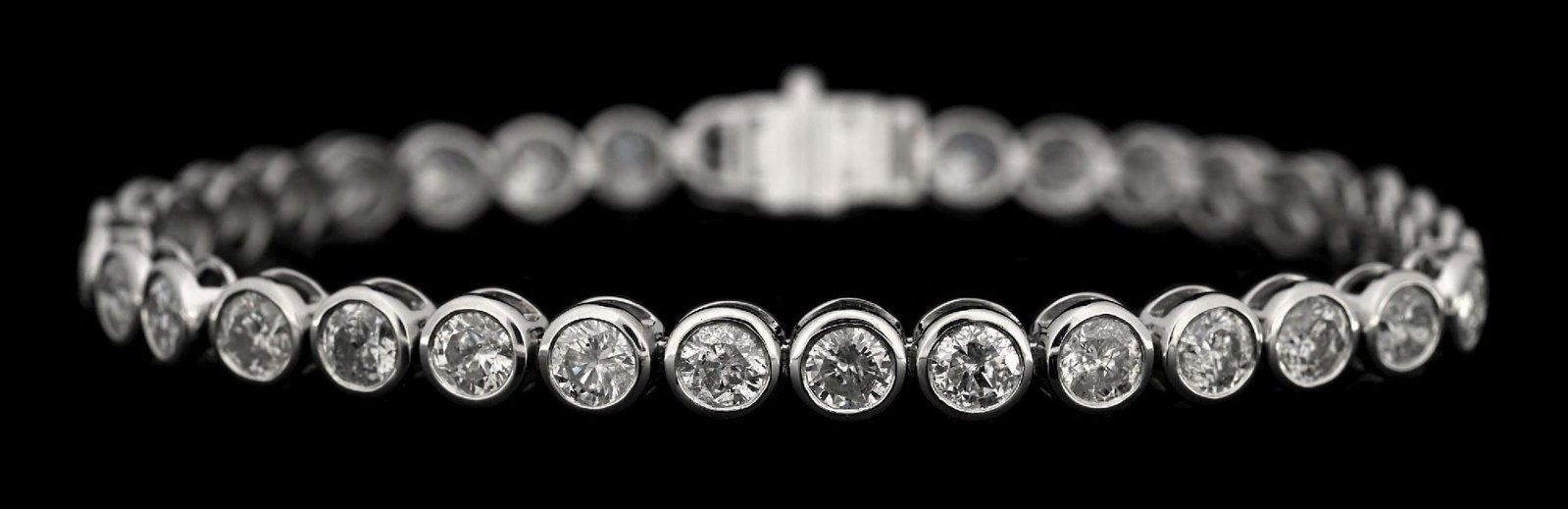 PLATINUM 9.67CT TW DIAMOND BRACELET W/REPORT: Platinum and diamond (9.67ctw) tennis bracelet accompanied by an original AIGL appraisal report with an ERRV of $47,073.00. (See additional website images for report specifications). Length measures
