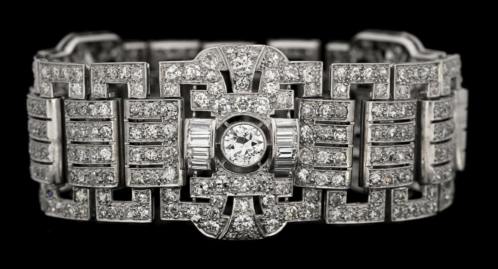 PLATINUM ART DECO 30CT TW DIAMOND BRACELET: Stunning antique platinum Art-Deco diamond bracelet. There are a 3 bezel-set central old European round cut diamonds, each measuring approximately 6.5mm in diameter, along with another 416 round cut d