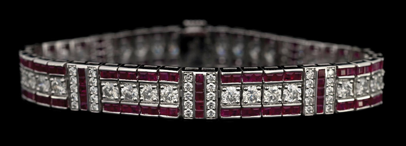 PLATINUM RUBY & DIAMOND BRACELET W/REPORT: Platinum ruby (9.46ctw) and diamond (7.32ctw) bracelet accompanied by an original GGA appraisal report with an ERRV of $66,570.00. (See additional website images for report specifications). Length mea