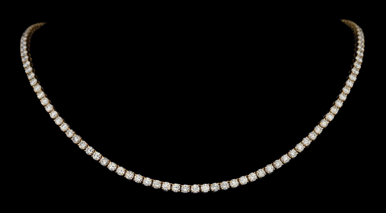 14K YELLOW GOLD DIAMOND NECKLACE, 12.14CT TW: 14k yellow gold diamond line necklace consisting of 121 round brilliant cut natural diamonds with a total weight of 12.14cts. Length measures 16". Width at center measures 3mm. Gross weight is 22.0 gr