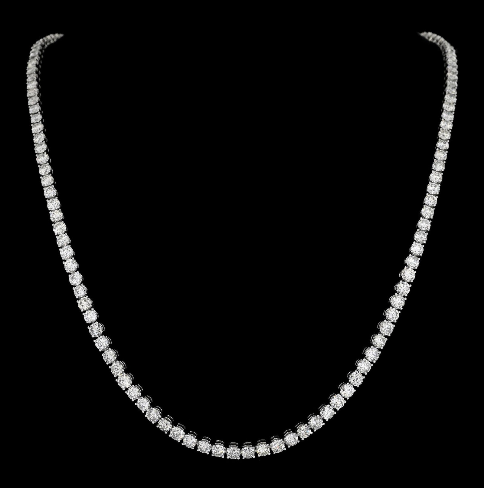 14K WHITE GOLD 38CT TW DIAMOND LINE NECKLACE: 14k white gold diamond line necklace consisting of 137 slightly graduated round brilliant cut near-colorless natural diamonds with a total weight of 38.10cts. Length measures 24". Width at center meas