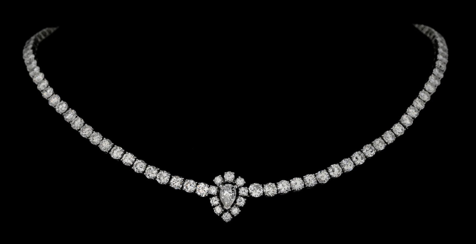 PLATINUM & DIAMOND NECKLACE, 23CT TW: Platinum and diamond necklace consisting of 1 pear brilliant cut natural diamond and 105 round brilliant cut natural diamonds with a combined total weight of 23.00cts. Length measures 15-1/2". Width a