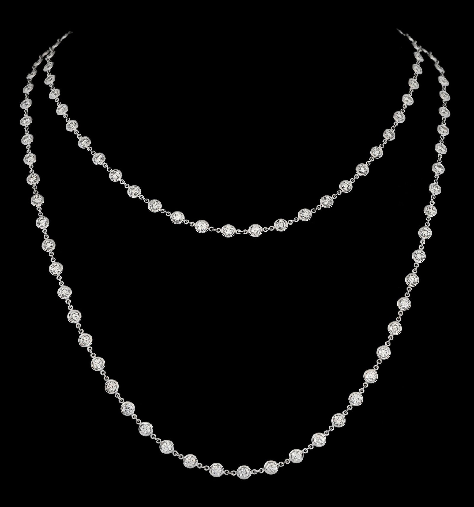 14K WHITE GOLD DIAMOND NECKLACE, 11.14CT TW: 14k white gold diamond necklace consisting of 112 round brilliant cut natural diamonds with a total weight of 11.14cts. Length measures 36". Bezel width measures 4.25mm. Gross weight is 19.5 grams. Ma