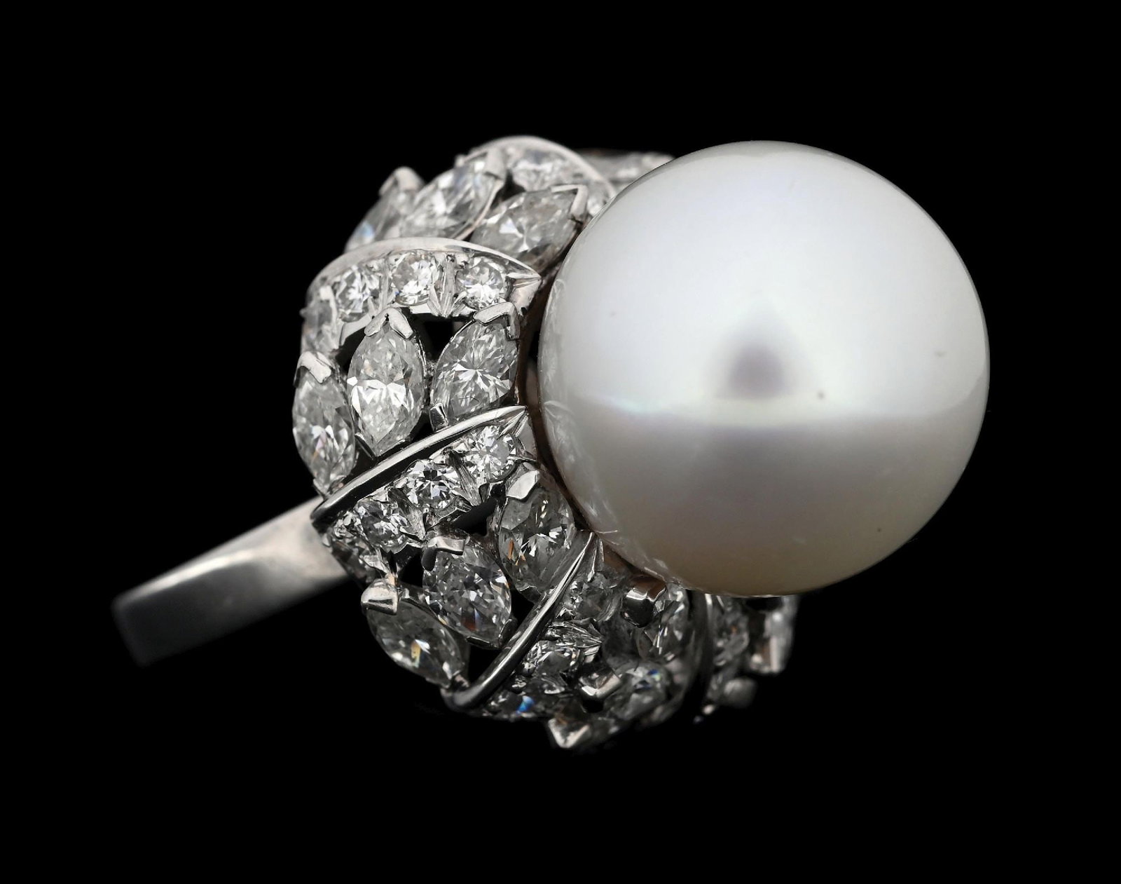PLATINUM SOUTH SEA PEARL & DIAMOND FASHION RING: Platinum south sea pearl and diamond fashion ring consisting of 1 large white south sea pearl measuring 15.5mm in diameter and 56 mixed round and marquise cut natural diamonds with a total weight of 5