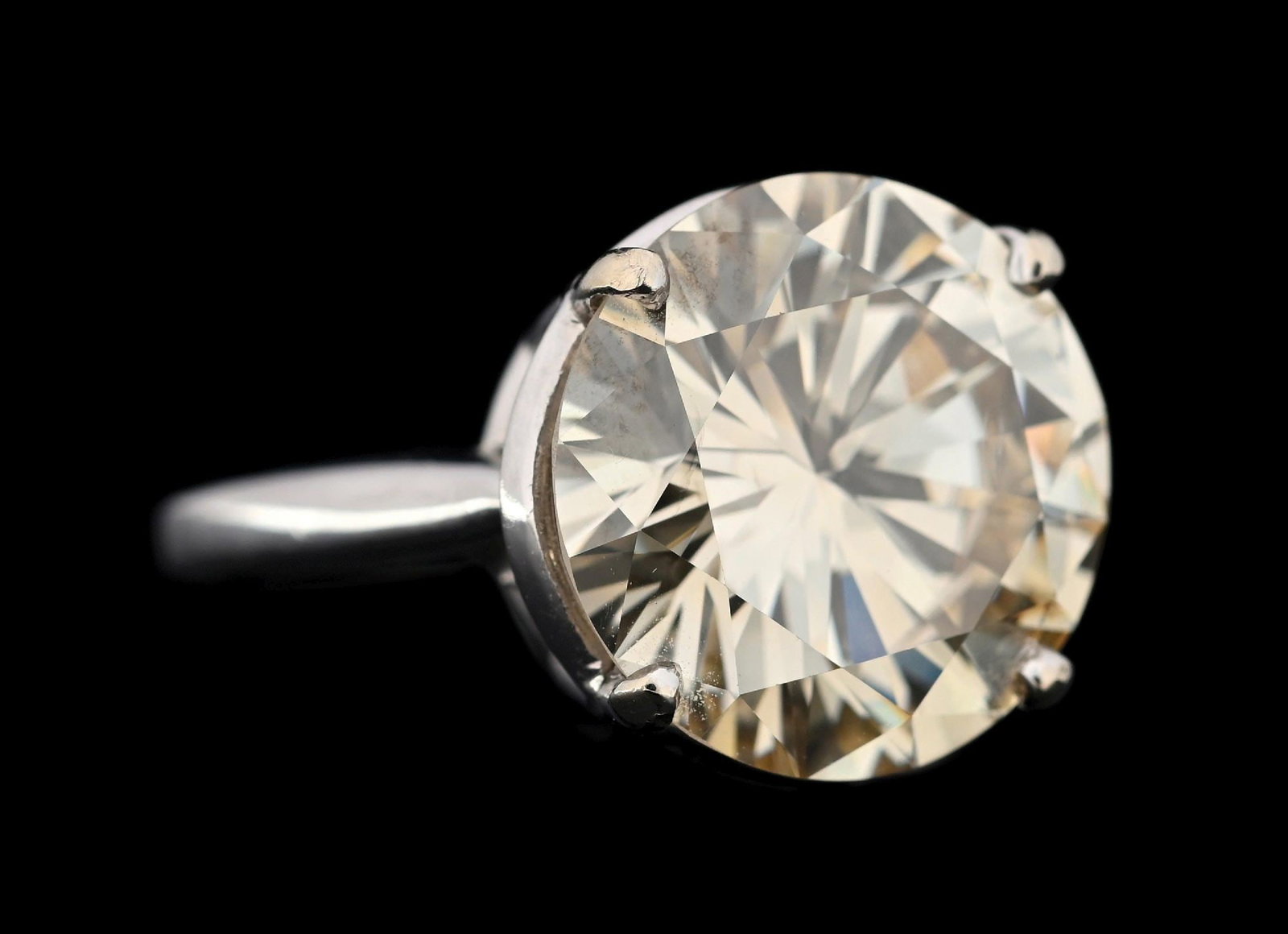 14K WHITE GOLD 7.87CT NATURAL LIGHT BROWN DIAMOND RING W/GIA REPORT: 14k white gold natural light brown diamond solitaire ring consisting of 1 round brilliant cut natural diamond weighing 7.87cts, graded Q/R color, very light brown, SI2 clarity. Ring is accompanied by 