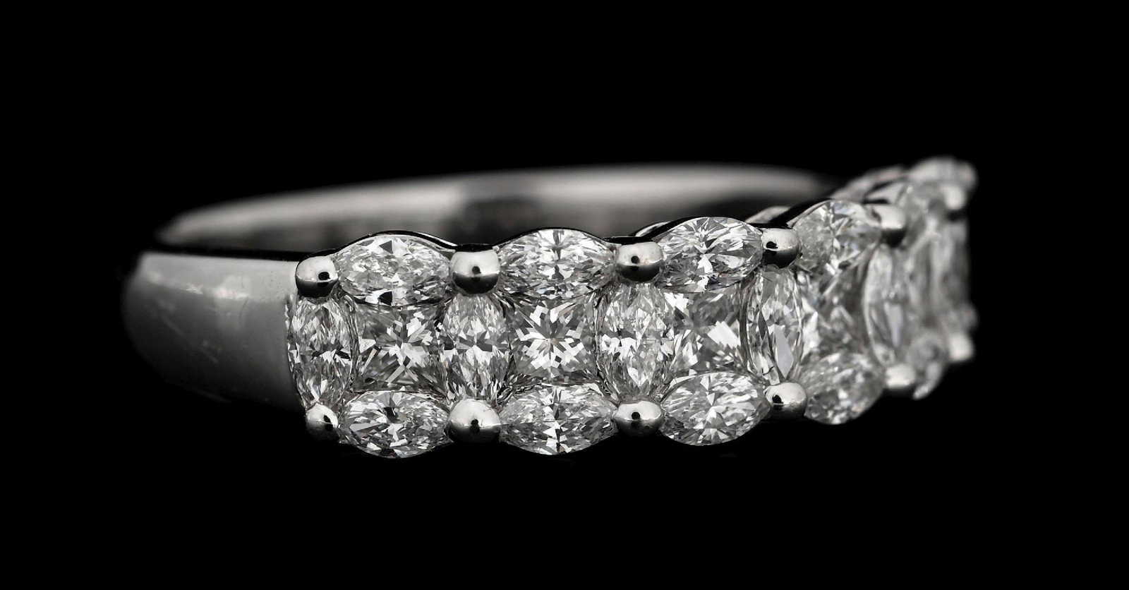 14K WHITE GOLD 2.50CT TW DIAMOND RING: 14k white gold diamond band set with 25 mixed marquise brilliant cut and princess cut near-colorless natural diamonds with a total weight of 2.50cts. Ring size 7. Width at top measures 5.5mm. Gross