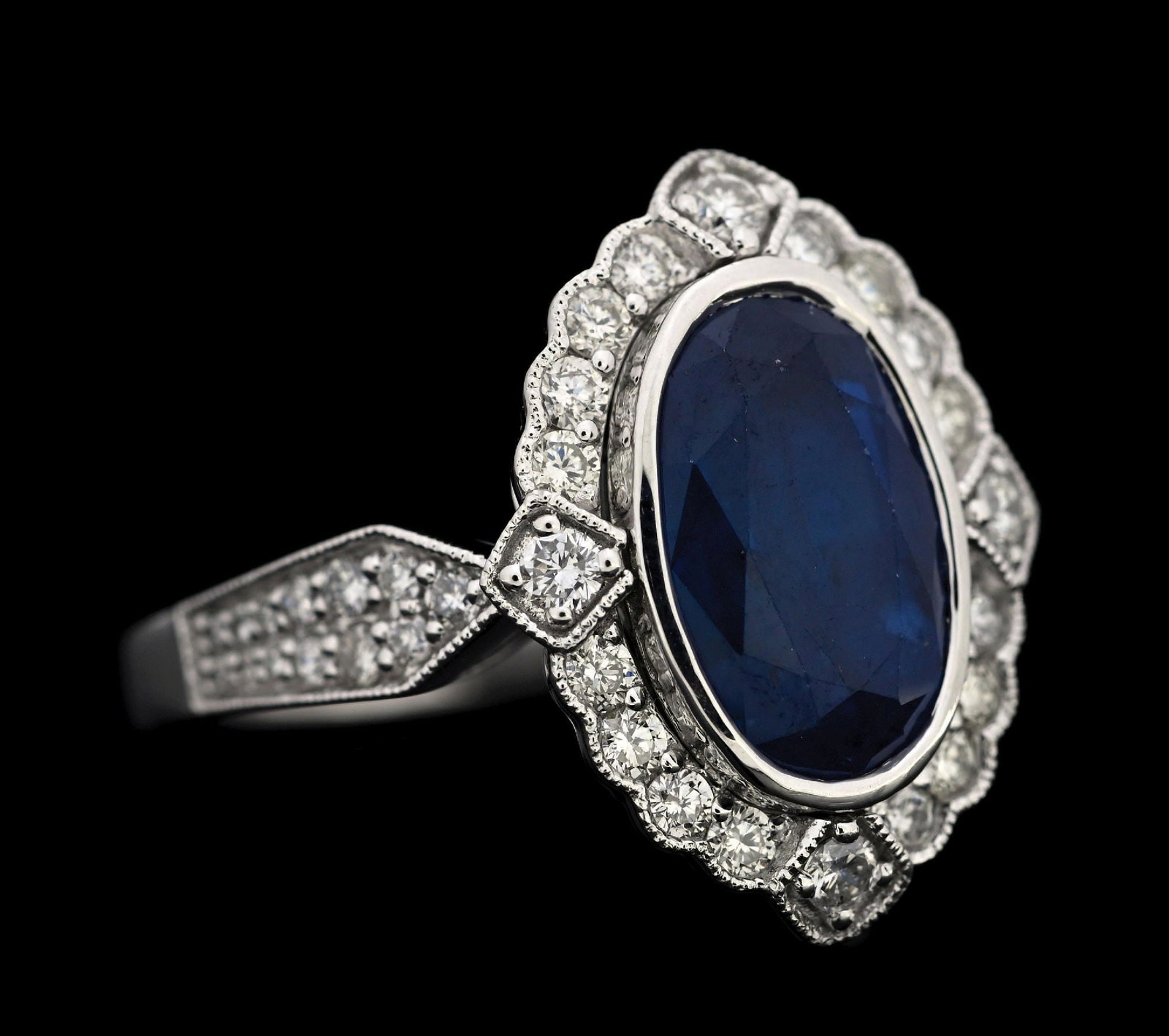 PLATINUM SAPPHIRE & DIAMOND RING W/GIA REPORT: Platinum sapphire (4.58ct) and diamond (0.70ctw) ring accompanied by an original GIA sapphire report and a GGA appraisal report with an ERRV of $25,860.00. (See additional website images for report