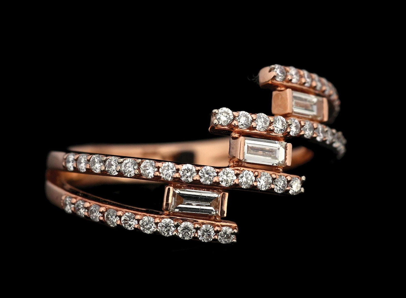 14K ROSE GOLD DIAMOND RING W/REPORT: 14k rose gold diamond (0.56ctw) ring accompanied by an original AIGL appraisal report with an ERRV of $4,566.00. (See additional website images for report specifications). Ring size 7-1/4. Width at