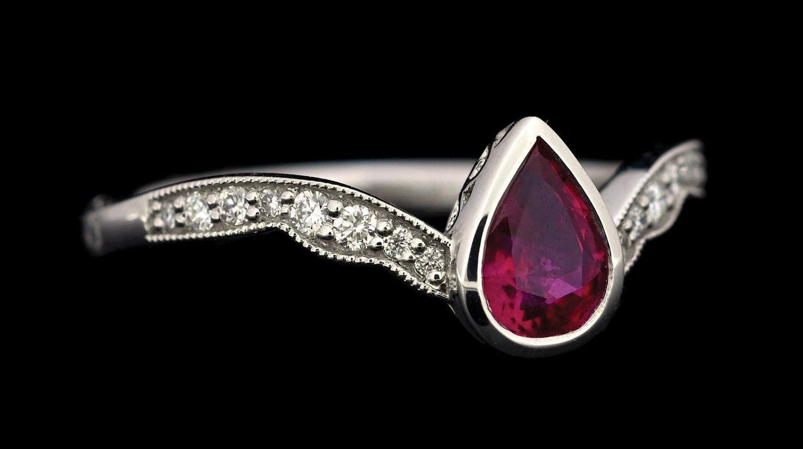 PLATINUM RUBY & DIAMOND RING W/REPORT: Platinum ruby (0.55ct) and diamond (0.11ctw) ring accompanied by an original AIGL appraisal report with an ERRV of $7,000.00. (See additional website images for report specifications). Ring size 6-3/4
