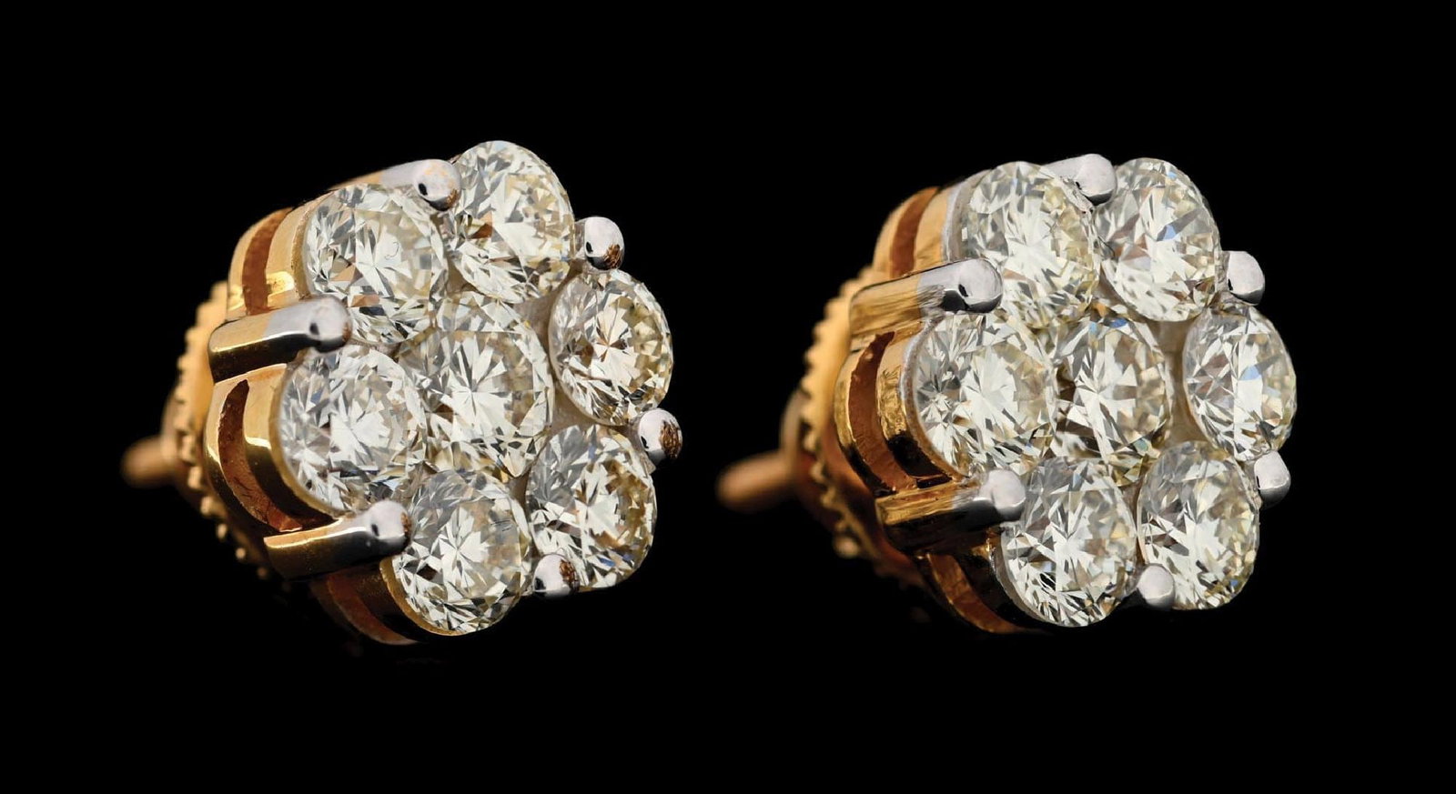 14K YELLOW GOLD 4CT TW DIAMOND FLOWER STUD EARRINGS BY ICEBOX: 14k yellow gold diamond cluster flower stud earrings consisting of 14 round brilliant cut natural diamonds with a total weight of 4.00cts, graded VS clarity. Threaded screw-back posts with large backs