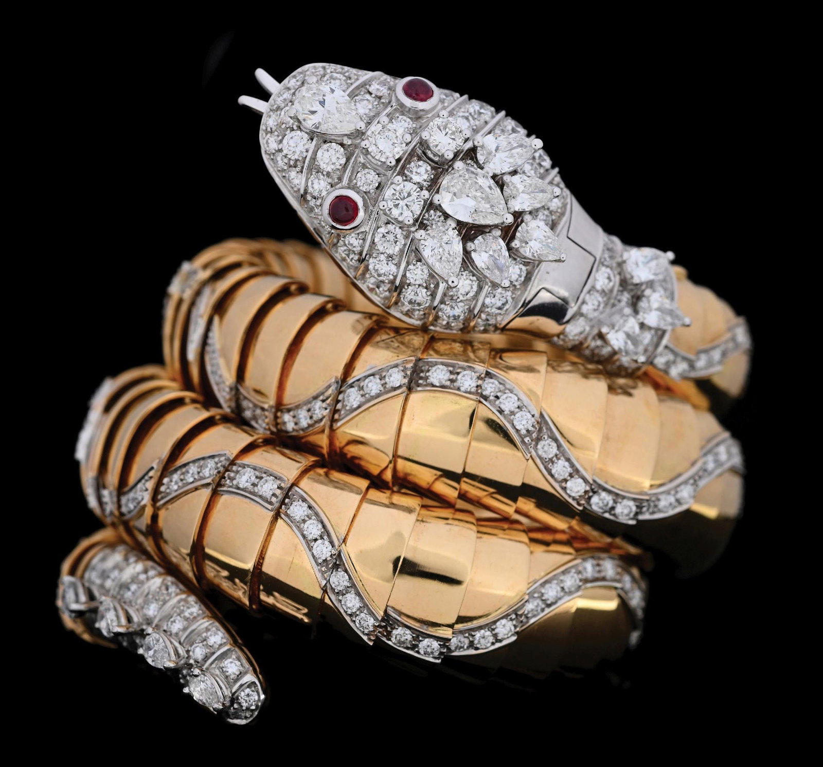 BVLGARI SERPENTI JAEGER-LECOULTRE 18K GOLD DIAMOND BRACELET W/SECRET WATCH: Rare and important vintage Bulgari Serpenti Jaeger-LeCoultre flexible 3-coil diamond and ruby bangle bracelet with secret hidden watch in 18k yellow and white gold. There are a total of 341 natural co