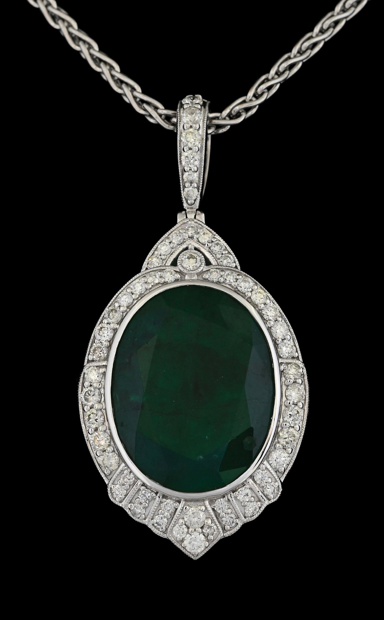 18K WHITE GOLD EMERALD & DIAMOND NECKLACE W/REPORT: 18k white gold emerald (17.43ct) and diamond (1.13ctw) pendant and 14k white gold 2mm woven wheat chain accompanied by an original AIGL appraisal report with an ERRV of $39,738.00. (See additional web