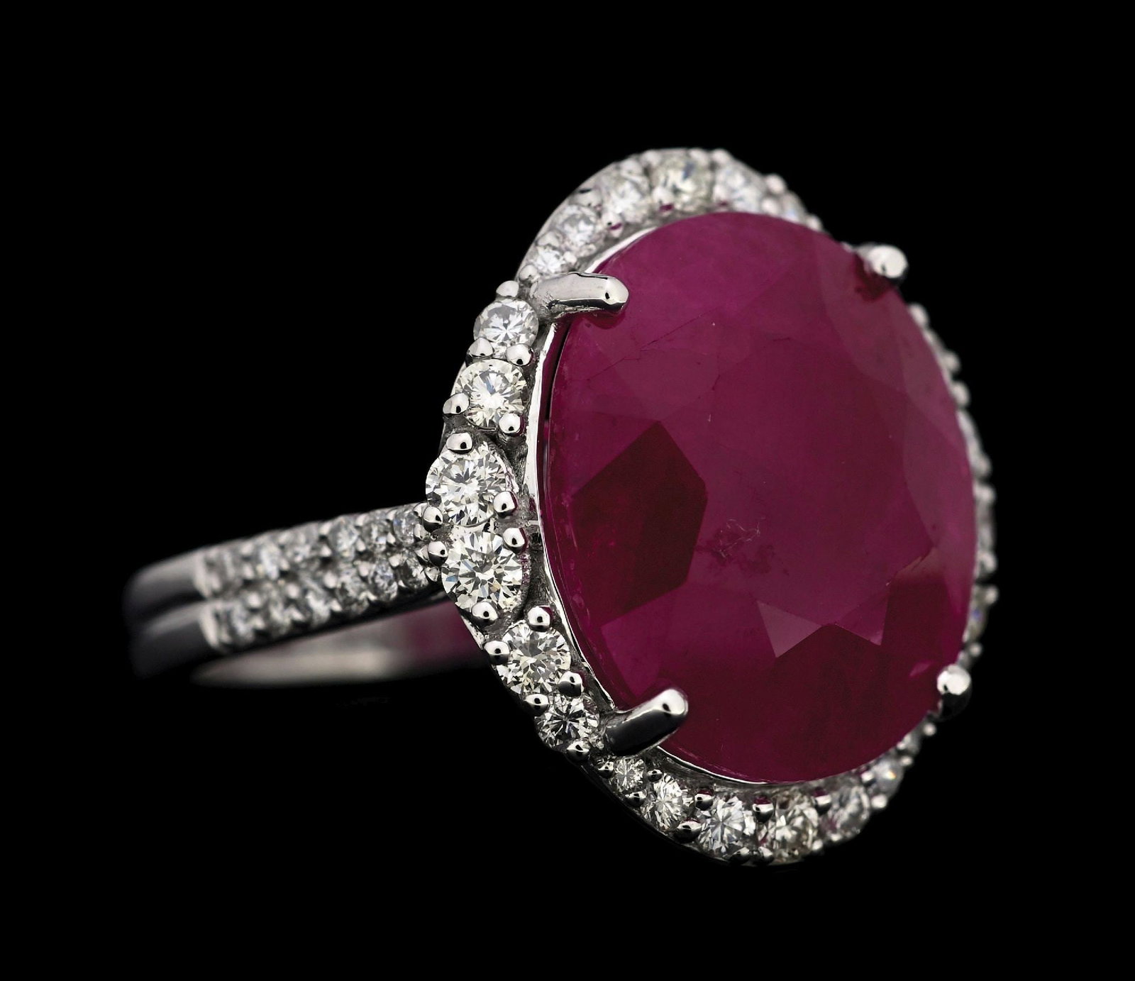 PLATINUM BURMESE RUBY & DIAMOND RING W/GIA REPORT: Platinum ruby (10.42ct) and diamond (0.71ctw) ring accompanied by an original GIA ruby origin report and a AIGL appraisal report with an ERRV of $37,037.00. (See additional website images for report s