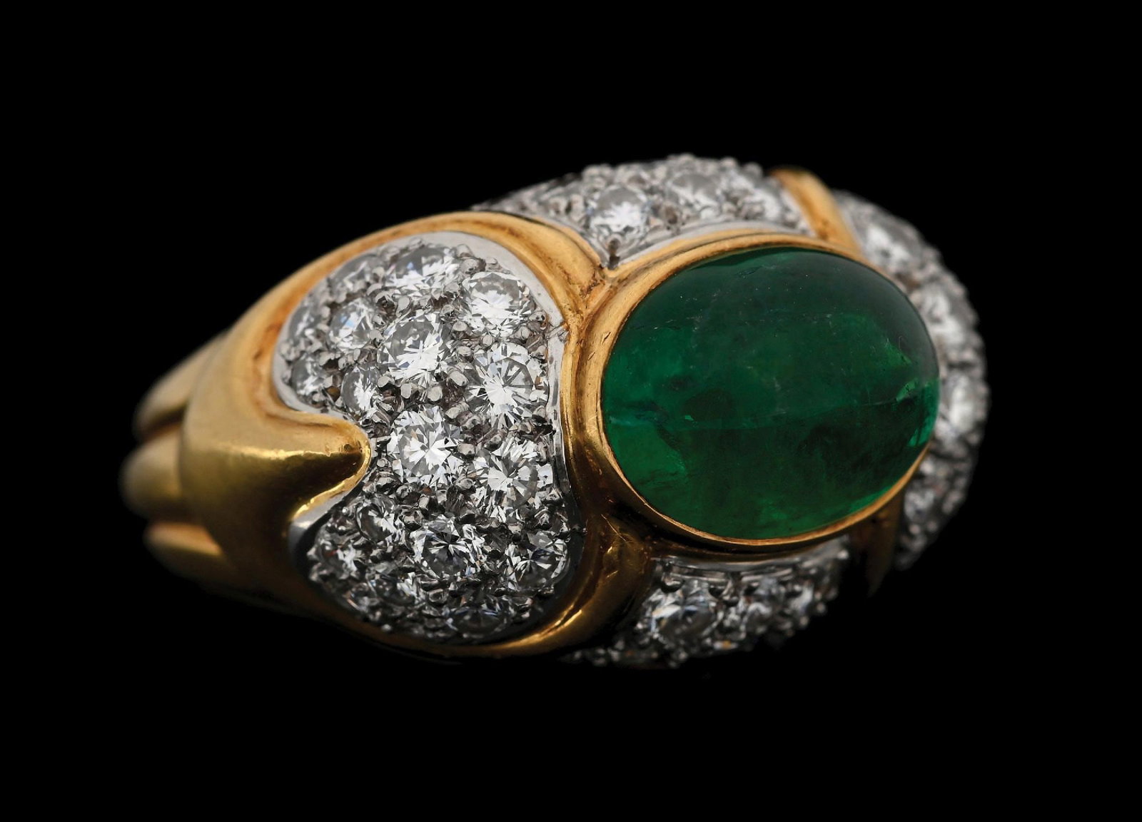 18K YELLOW GOLD & PLATINUM EMERALD & DIAMOND RING: 18k yellow gold and platinum emerald and diamond ring consisting of 1 oval cabochon cut emerald weighing 4.50cts and 54 round brilliant cut natural diamonds with a total weight of 2.00cts. Width at to