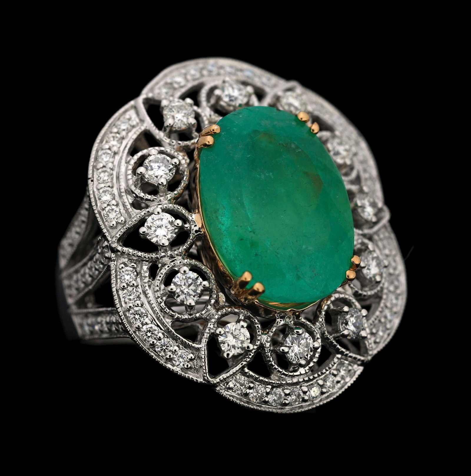 18K T/T GOLD COLOMBIAN EMERALD & DIAMOND RING W/GIA REPORT: 18k white and yellow gold Columbian emerald (6.71ct) and diamond (0.98ctw) ring accompanied by an original GIA emerald origin report and a GGA appraisal report with an ERRV of $39,270.00. (See additio