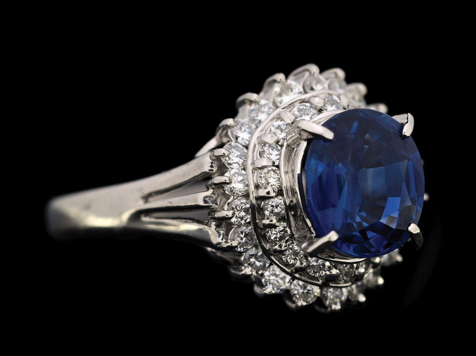 PLATINUM SAPPHIRE & DIAMOND RING W/REPORT: Platinum sapphire (2.10ct) and diamond (0.48ctw) ring accompanied by an original GGA appraisal report with an ERRV of $14,390.00. (See additional website images for report specifications). Ring size 6