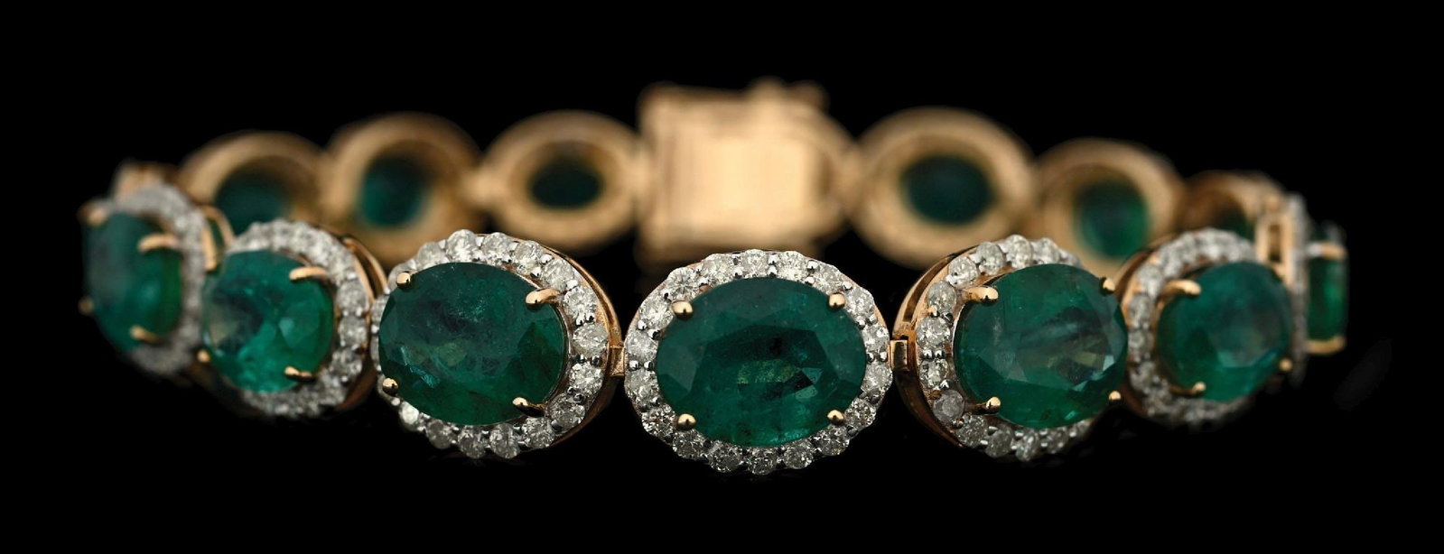 14K YELLOW GOLD EMERALD & DIAMOND BRACELET W/REPORT: 14k yellow gold emerald (22.61ctw) and diamond (4.01ctw) bracelet accompanied by an original AIGL appraisal report with an ERRV of $49,261.00. (See additional website images for report specifications)