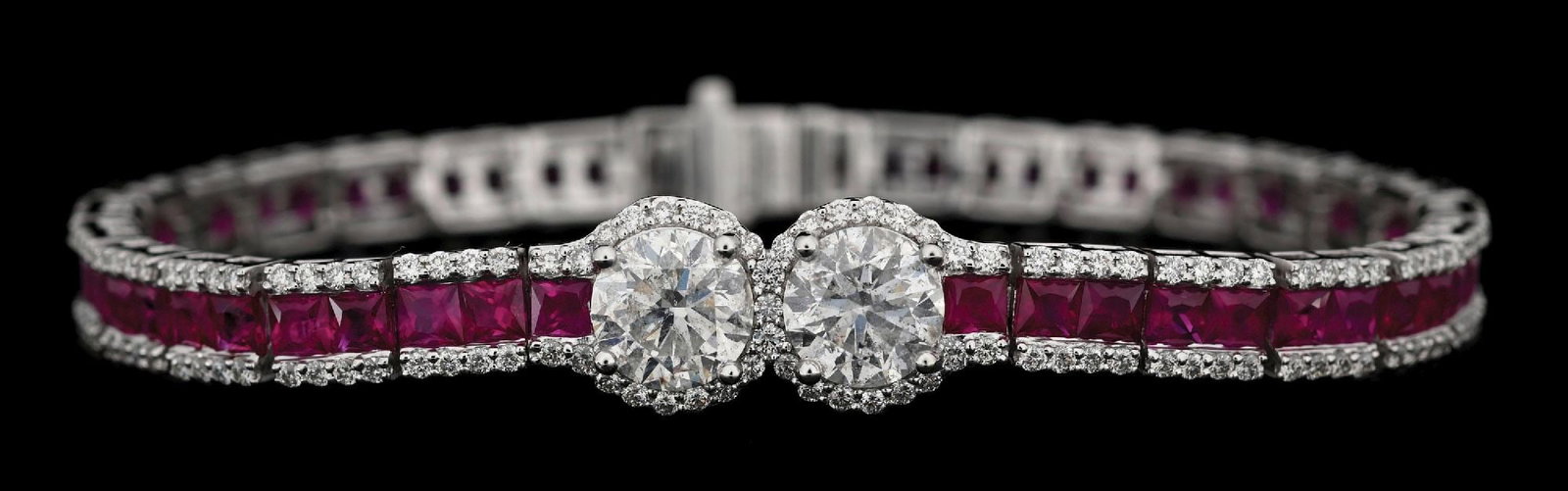 PLATINUM RUBY & DIAMOND BRACELET W/REPORT: Platinum ruby (8.93ctw) and diamond (5.34ctw) bracelet accompanied by an original GGA appraisal report with an ERRV of $86,930.00. (See additional website images for report specifications). Length mea