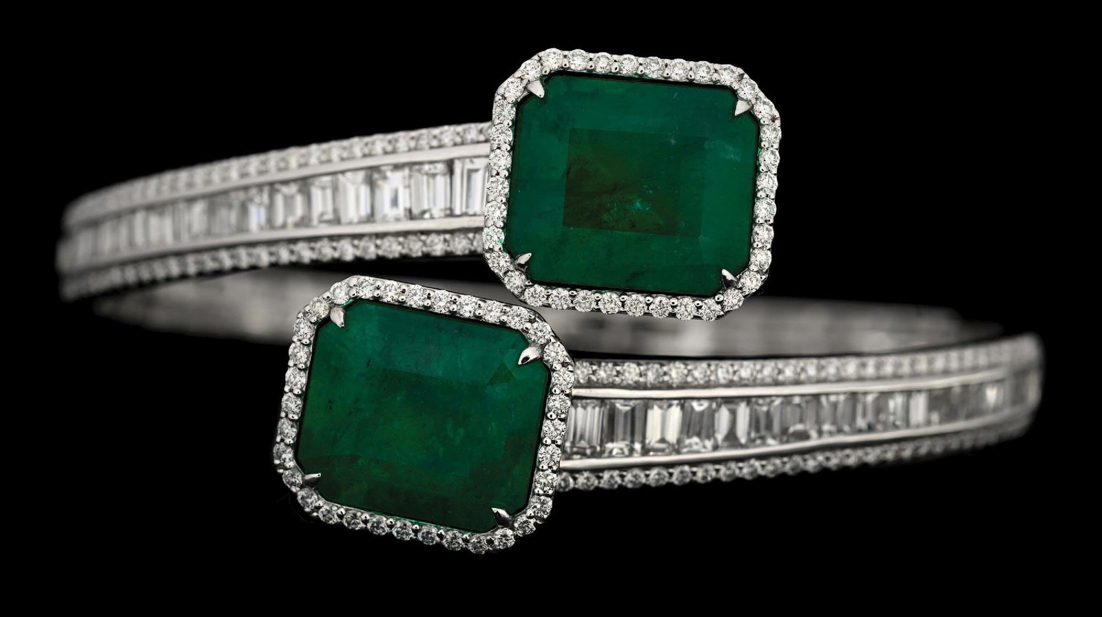 PLATINUM EMERALD & DIAMOND BANGLE BRACELET W/REPORT: Platinum emerald (16.38ctw) and diamond (4.59ctw) spring-loaded bangle bracelet accompanied by an original AIGL appraisal report with an ERRV of $141,200.00. (See additional website images for report 