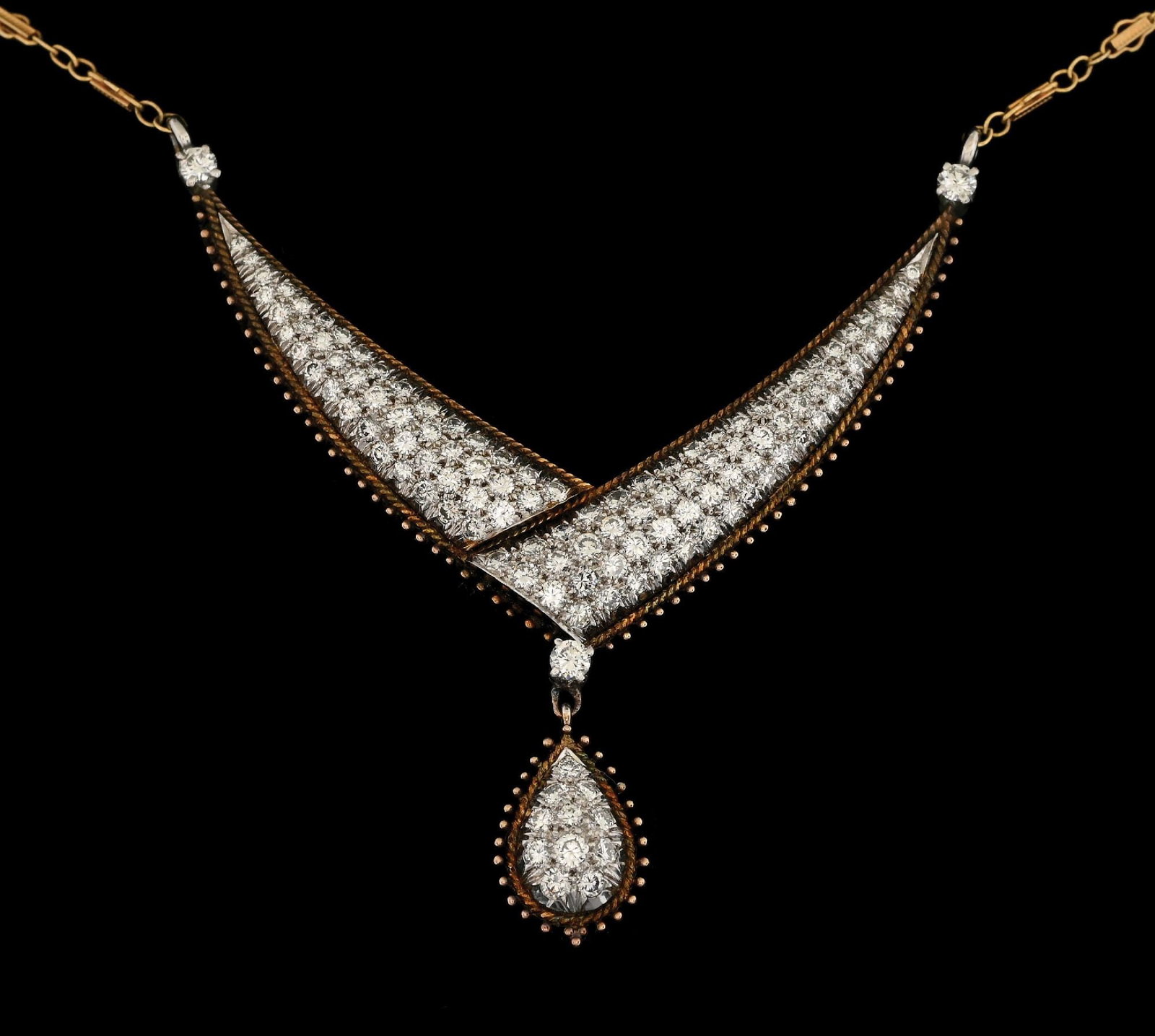 14K T/T GOLD DIAMOND NECKLACE, 2.75CT TW: 14k two-tone yellow and white gold diamond necklace consisting of 121 pave-set round brilliant cut natural diamonds with a total weight of 2.75cts. Length measures 16" plus 1" drop pendant. Width meas