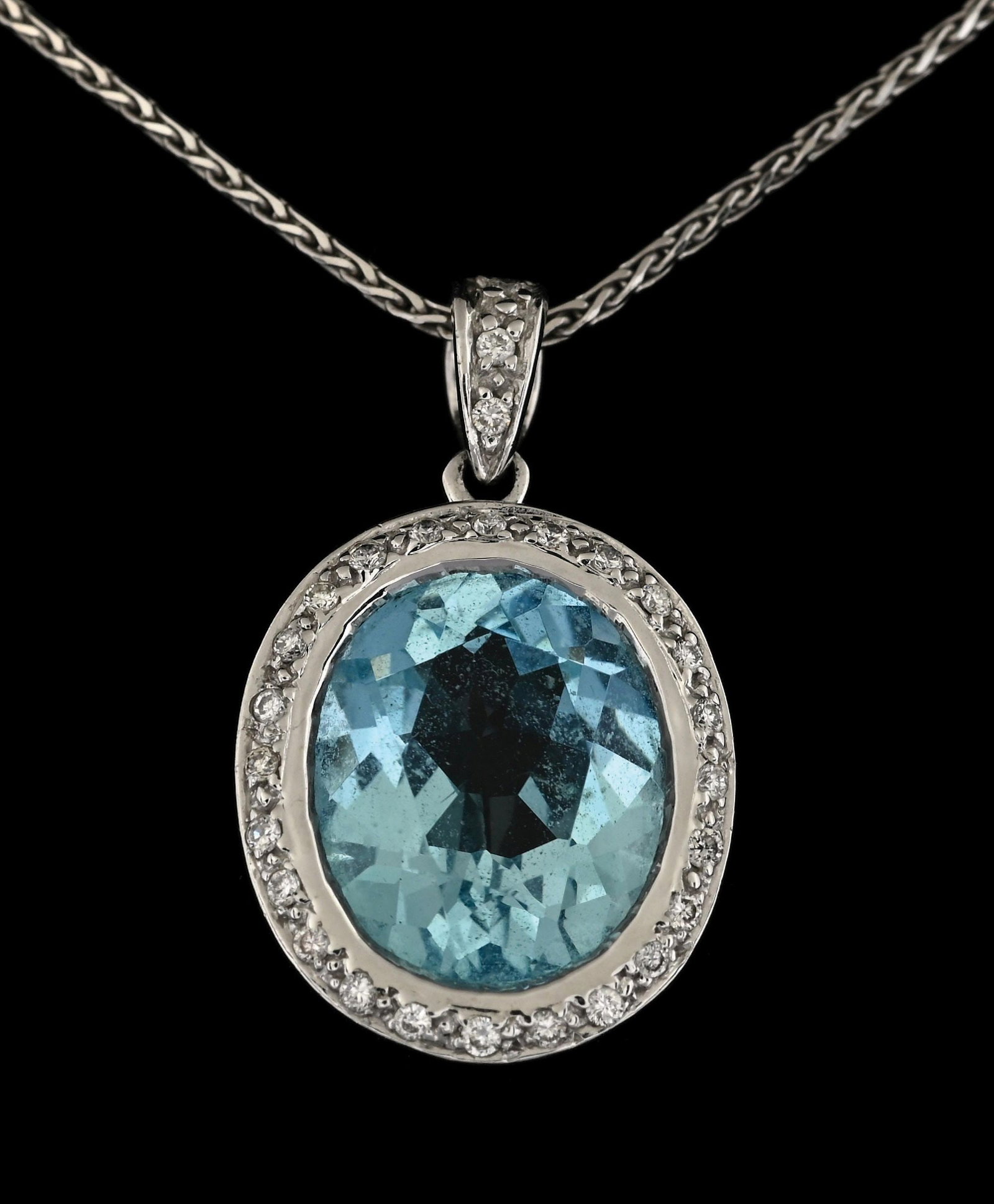 14K WHITE GOLD AQUAMARINE & DIAMOND NECKLACE: 14k white gold oval aquamarine (4.00cts) and round diamond (27 @ 0.30ctw) pendant with chain. Length measures 18" plus 7/8" drop pendant. Pendant width measures 13.5mm. Gross weight is 6.8 grams. Mark