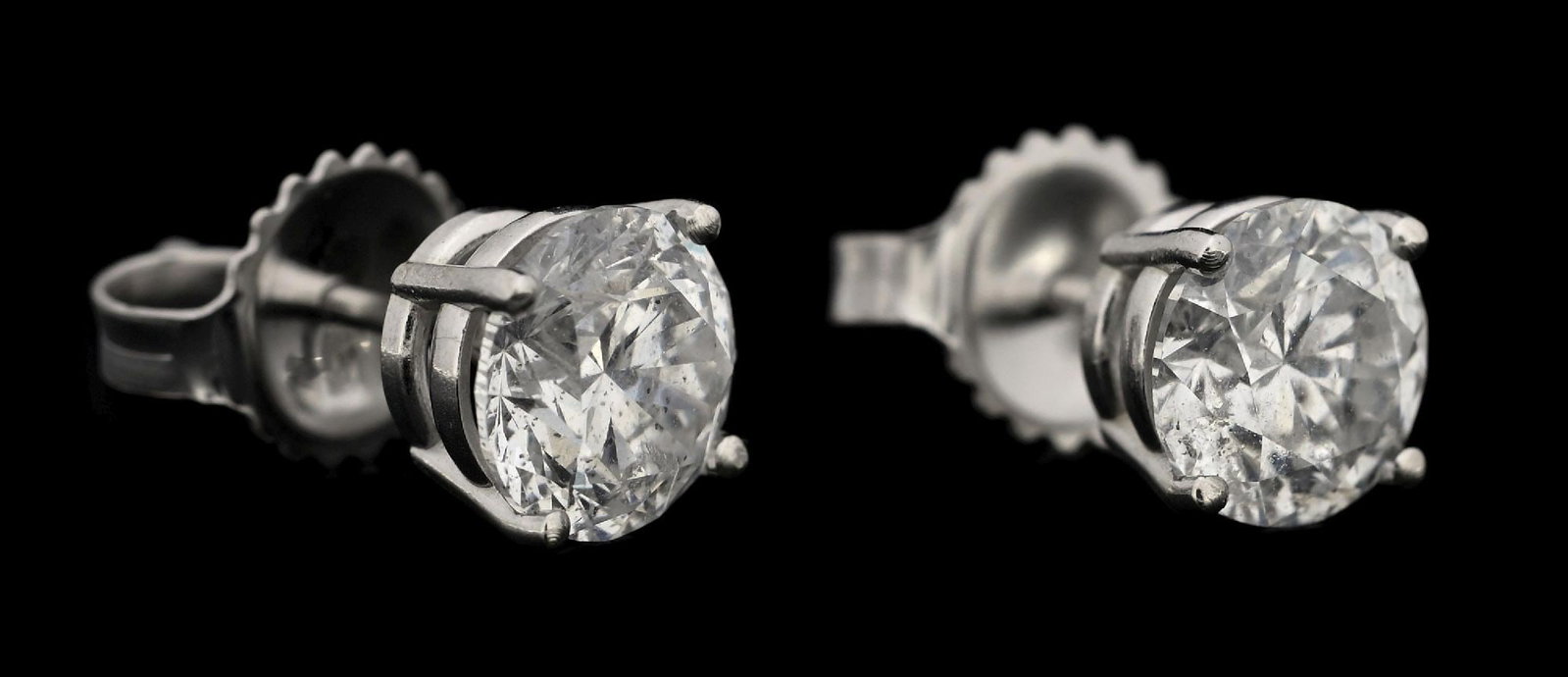 14K WHITE GOLD 2.06CT TW DIAMOND STUD EARRINGS W/REPORT: 14k white gold diamond (2.06ctw) stud earrings accompanied by an original GGA appraisal report with an ERRV of $18,730.00. (See additional website images for report specifications). Width measures 6.2