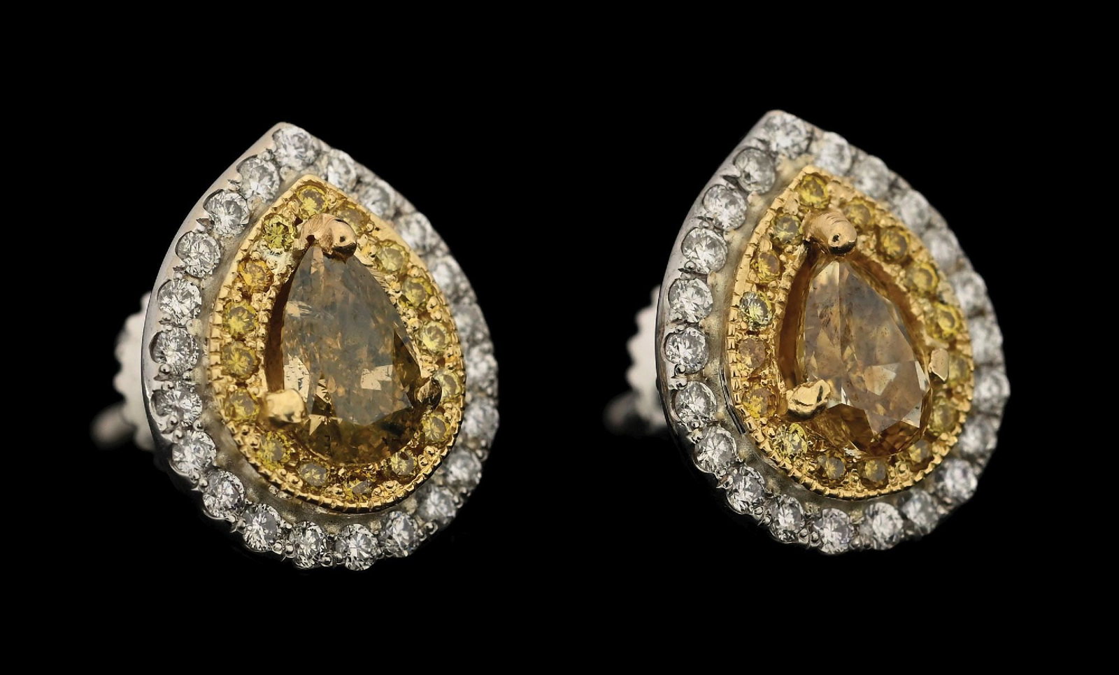 18K TWO-TONE FANCY YELLOW DIAMOND EARRINGS W/REPORT: 18k white and yellow gold fancy yellow diamond (1.02ctw) and white diamond (0.32ctw) screw-back earrings accompanied by an original AIGL appraisal report with an ERRV of $9,650.00. (See additional web