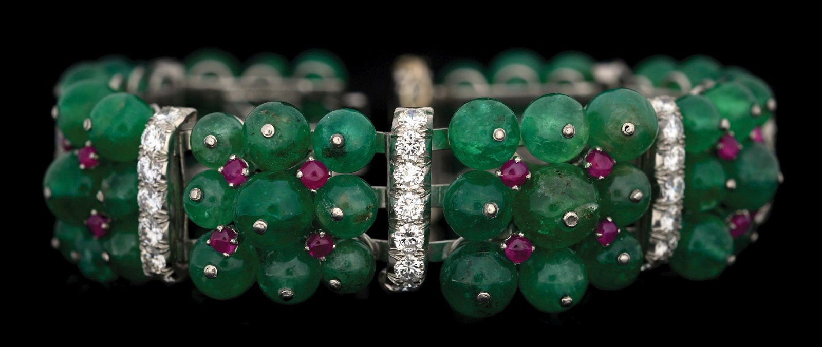 DAVID WEBB 18K WHITE GOLD & PLATINUM EMERALD, RUBY & DIAMOND BRACELET: 18k white gold and platinum David Webb designer emerald, ruby and diamond bracelet. There are a total of 56 round brilliant cut near-colorless natural diamonds each measuring approximately 3mm in diam