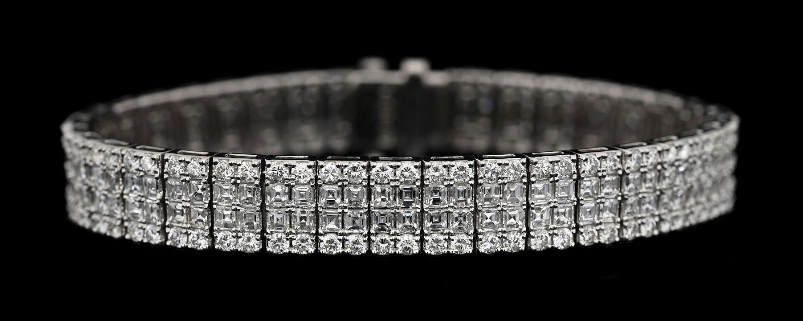 18K WHITE GOLD 4-ROW DIAMOND LINE BRACELET, 12.16CT TW: 18k white gold 4-row diamond line bracelet consisting of 296 mixed square and round cut near-colorless natural diamonds with a total weight of 12.16cts. Width measures 9.25mm. Length measures 7". Gros