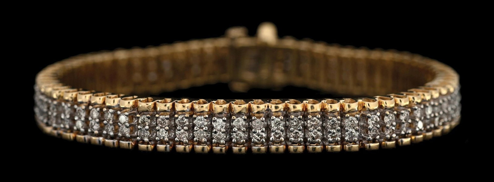 14K YELLOW GOLD 4CT TW DIAMOND TENNIS BRACELET: 14k yellow gold 2-row diamond tennis bracelet consisting of 136 round brilliant cut natural diamonds with an estimated total weight of 4.00cts. Length measures 7". Width measures 7.5mm. Gross weight i