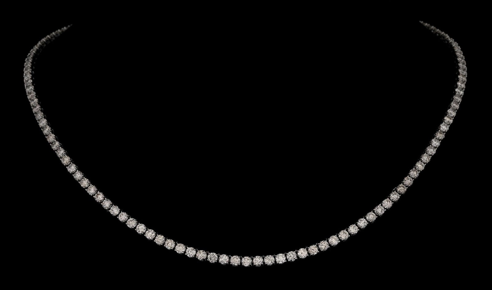 14K WHITE GOLD 10.78CT TW DIAMOND LINE NECKLACE W/REPORT: 14k white gold diamond (10.78ctw) line necklace accompanied by an original GGA appraisal report with an ERRV of $32,680.00. (See additional website images for report specifications). Length measures 1