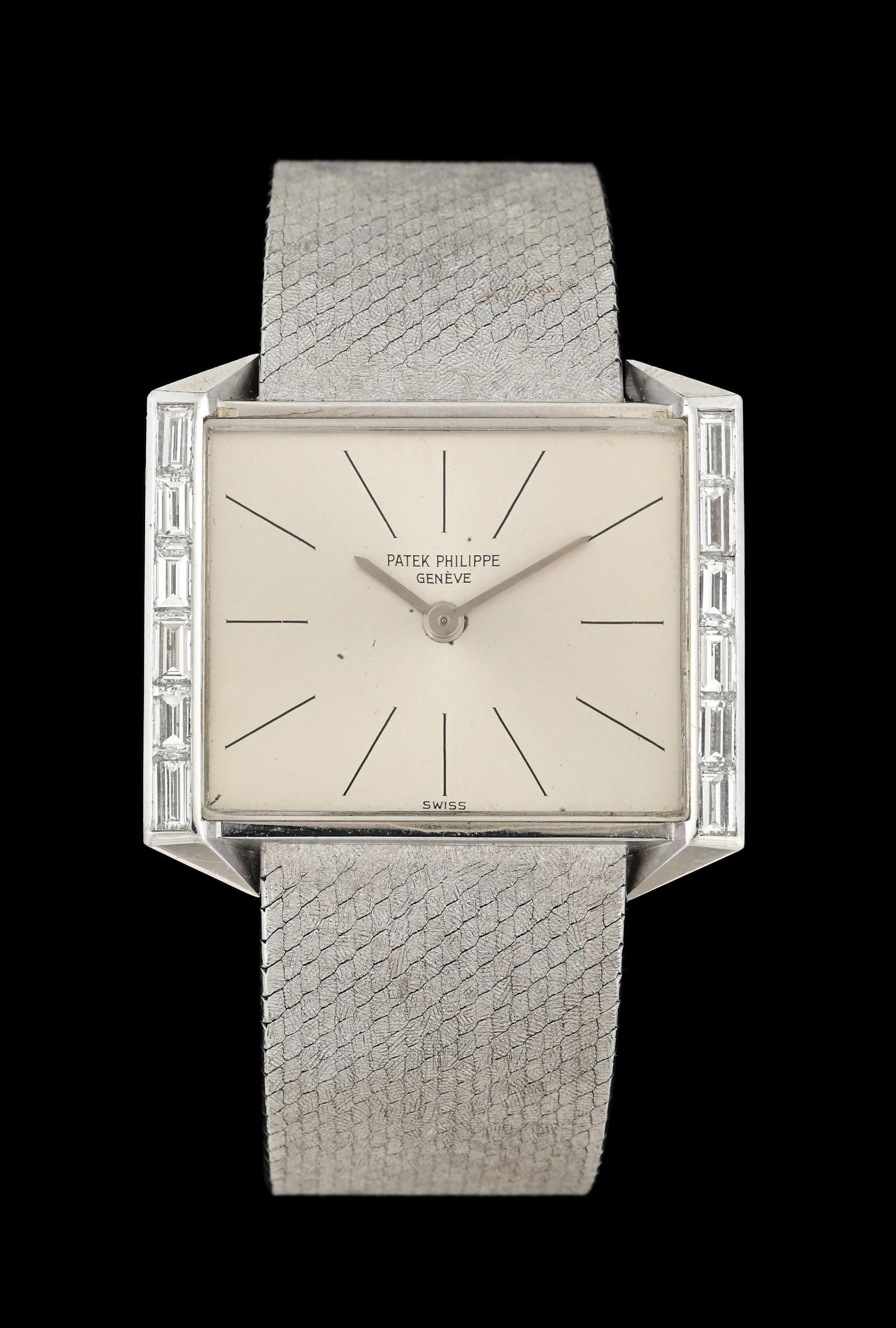 18K WHITE GOLD PATEK PHILIPPE DIAMOND WRISTWATCH, REF. 3506/2: 18k white gold and diamond Patek Philippe wristwatch with integrated watch bracelet, circa 1964. Case measures 29mm in diameter, and is set with 12 straight baguette cut natural colorless diamonds wit