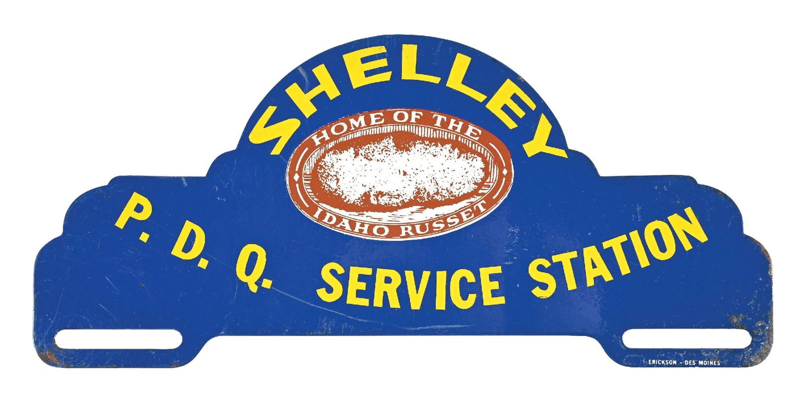 SHELLEY P.D.Q. SERVICE STATION TIN LICENSE PLATE TOPPER: SST. Maker Marked Erikson, Des Moines. CONDITION: Excellent color & gloss, showing some minor surface scratching and light general age wear. Minor paint wear along the edges. Graphic in excellent cond