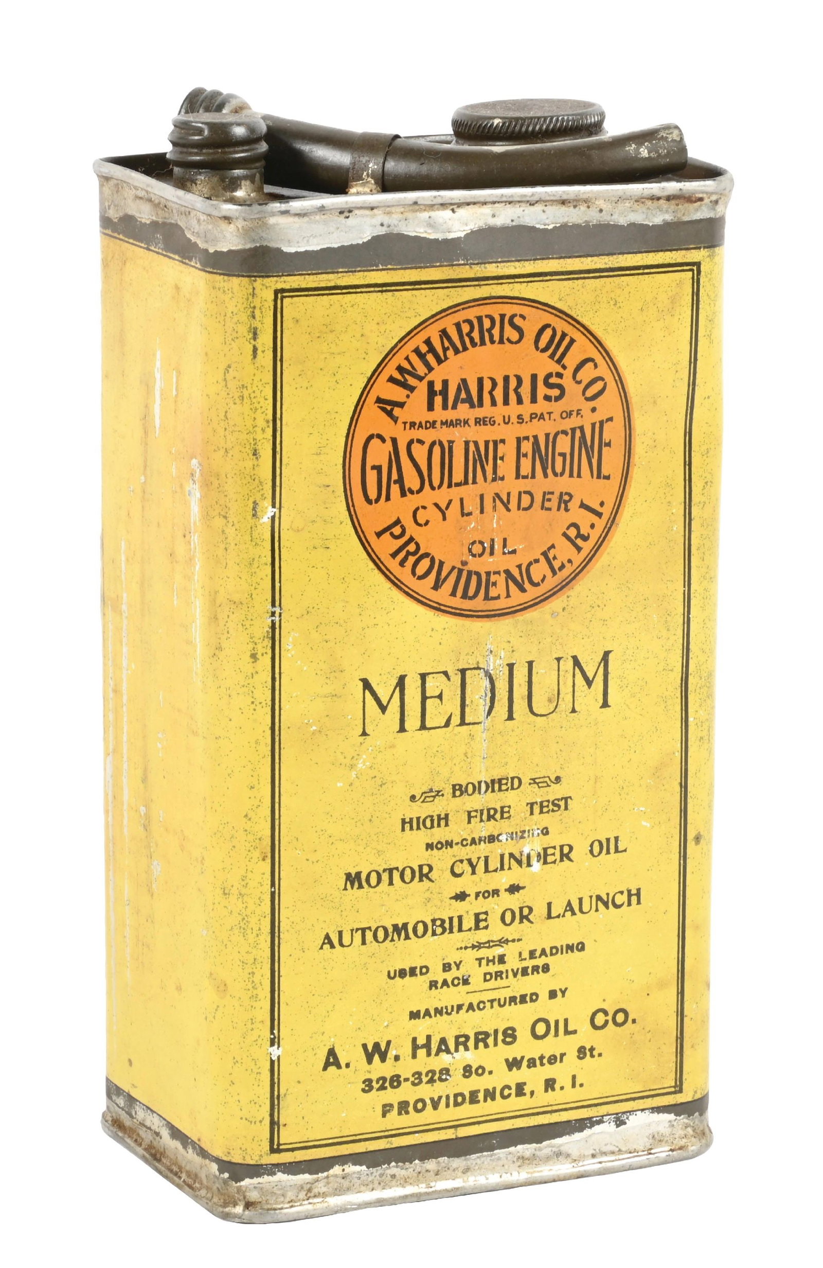 A.W. HARRIS OIL CO. MEDIUM MOTOR CYLINDER OIL CAN: C. 1920s. CONDITION: Very good color throughout showing some minor areas of dirt staining throughout. Minor areas of surface scratching with original lid and spout intact. A well displaying example. C