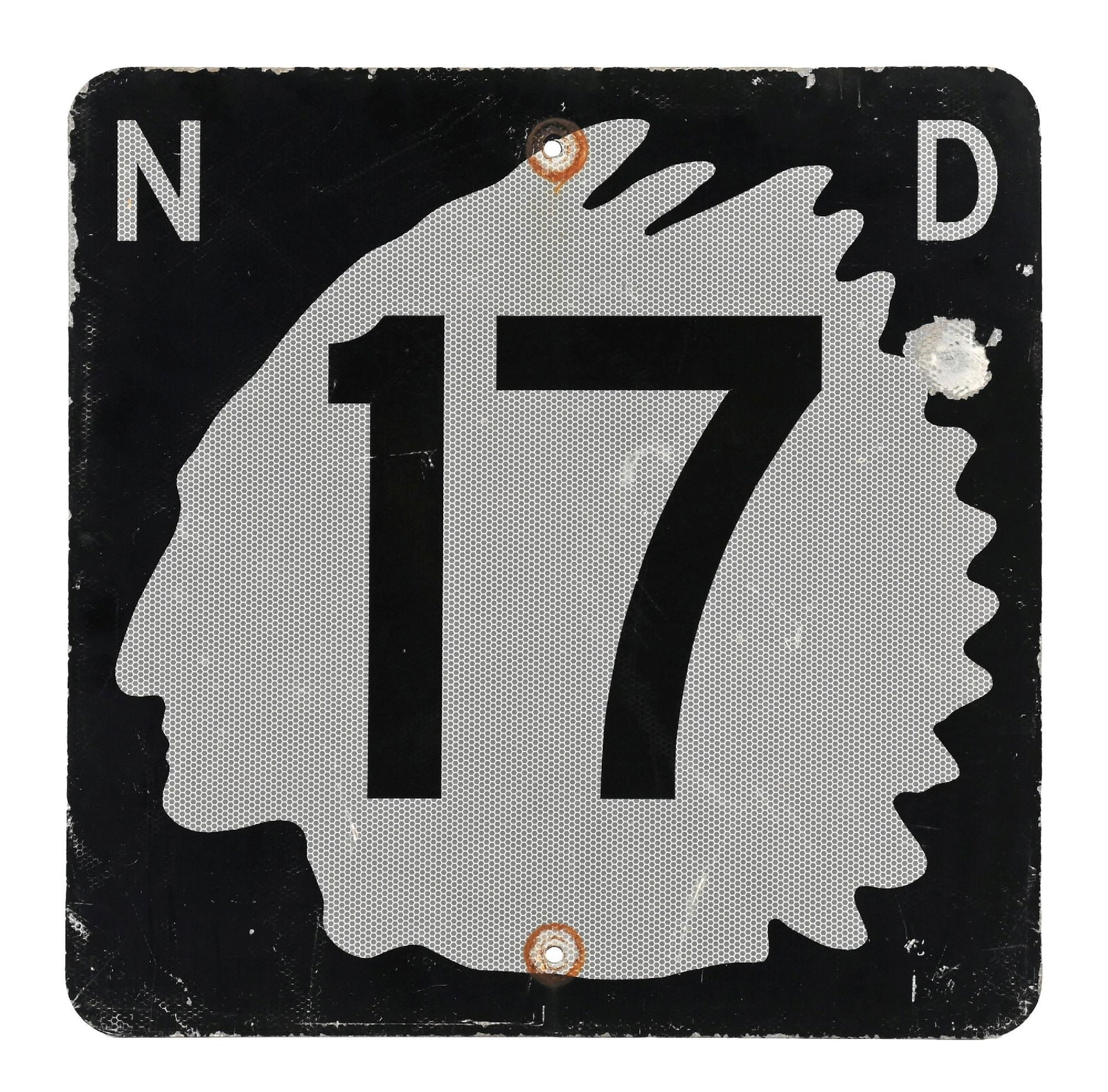 NORTH DAKOTA HIGHWAY 17 METAL REFLECTIVE ROAD SIGN WITH INDIAN HEAD GRAPHIC: Single-Sided Aluminum Sign. CONDITION: Overall very good showing bright color & gloss with a reflective surface. Areas of general age wear and surface scratching present. Showing a larger hit at the r