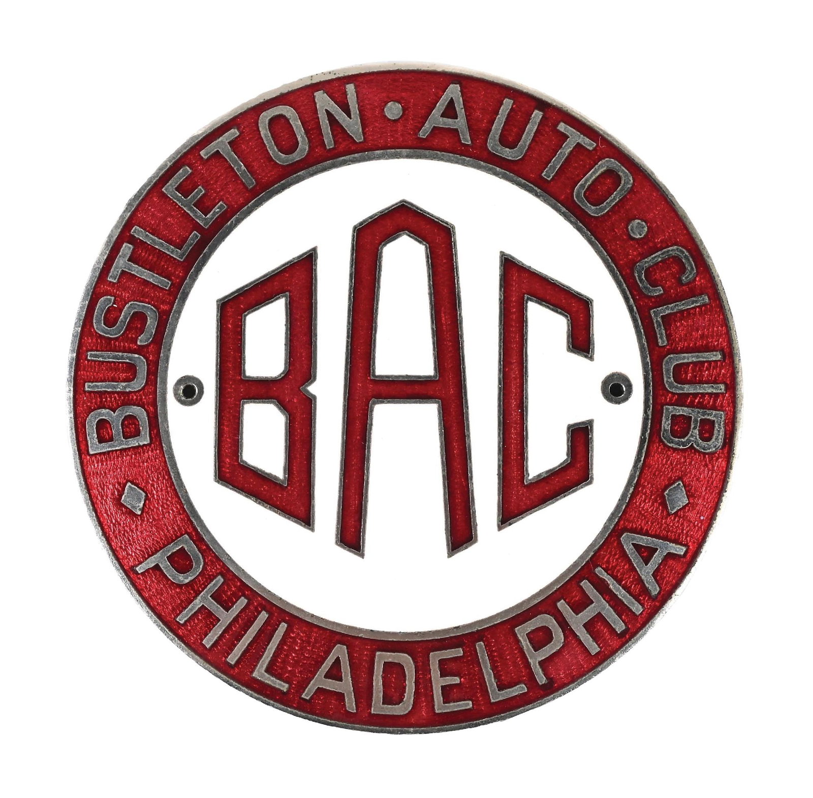 N.O.S. BUSTLETON AUTOMOBILE CLUB PHILADELPHIA CLOISONNÉ RADIATOR BADGE: Single-Sided Cloisonné & Metal Radiator Badge. C. 1920s. CONDITION: Brilliant new old stock condition showing no notable wear with outstanding color & gloss throughout. Excellent condition mounti