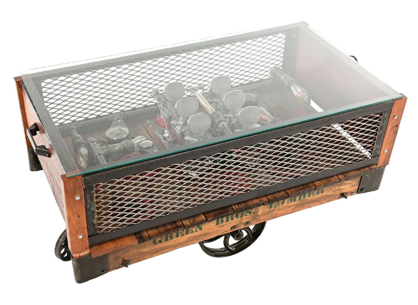 ORNATE GREEN BROTHERS LUMBER INDUSTRIAL COFFEE TABLE CART SHOWING AUTOMOTIVE INTERIOR DISPLAY: A very unique Coffee Table custom made from an antique lumber cart showing added glass top with showcase of industrial and automotive gears, lamps, gauges and carburetors. CONDITION: Excellent restore