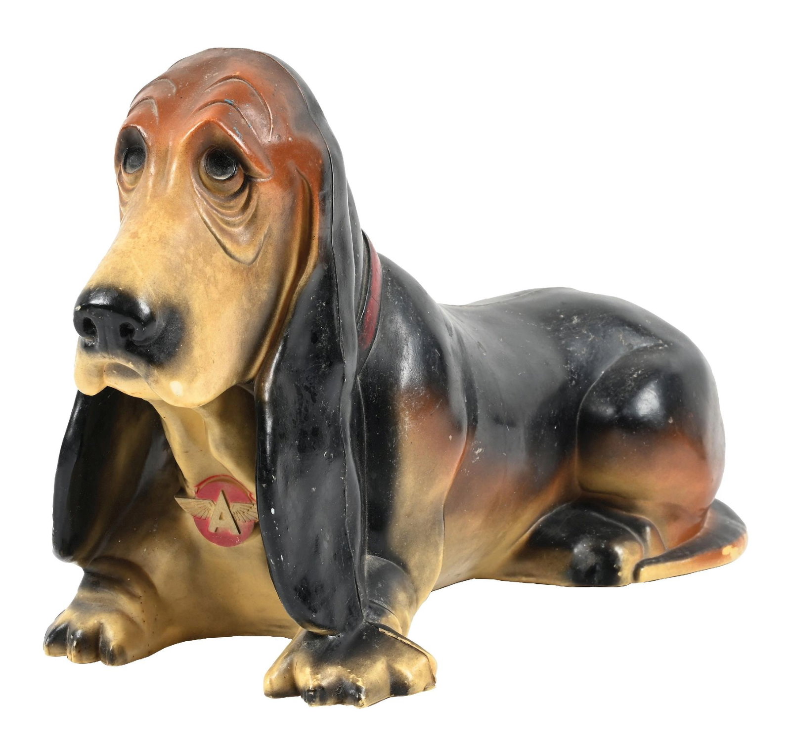 FLYING A BASSET HOUND PIGGY BANK: C. 1950s. CONDITION: Overall very good showing light general age and use wear. Body showing great original paint with light chips. Flying A graphic in excellent condition. Condition: (ORIGINAL). Dimen