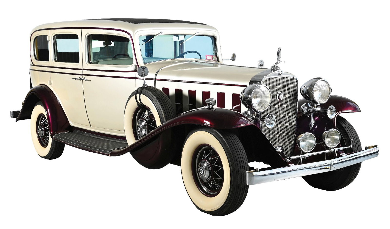 1932 CADILLAC 355-B IMPERIAL LIMOUSINE.: This imposing Fisher-bodied seven-passenger Imperial Limousine is finished in cream with burgundy fenders and accents. Built on Cadillac’s 140-inch wheelbase, it features dual enclosed side moun