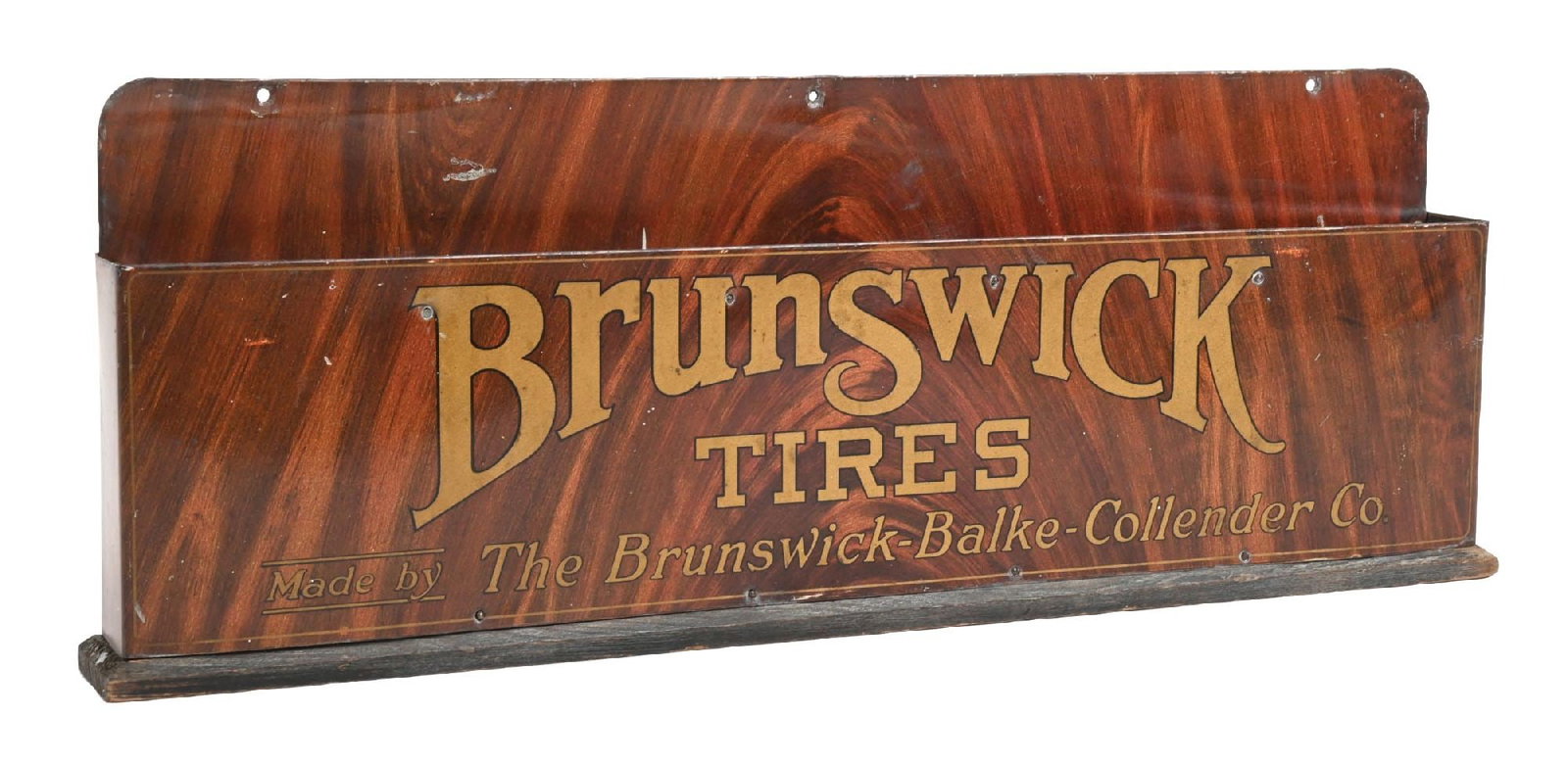 BRUNSWICK TIRES TIN COUNTERTOP DISPLAY W/ ORIGINAL WOODEN BASE: SST. C. 1920s. CONDITION: Excellent color and gloss throughout, showing minor areas of light surface scratch. Wooden base is in excellent original condition, as are the wooden dividers in the interior