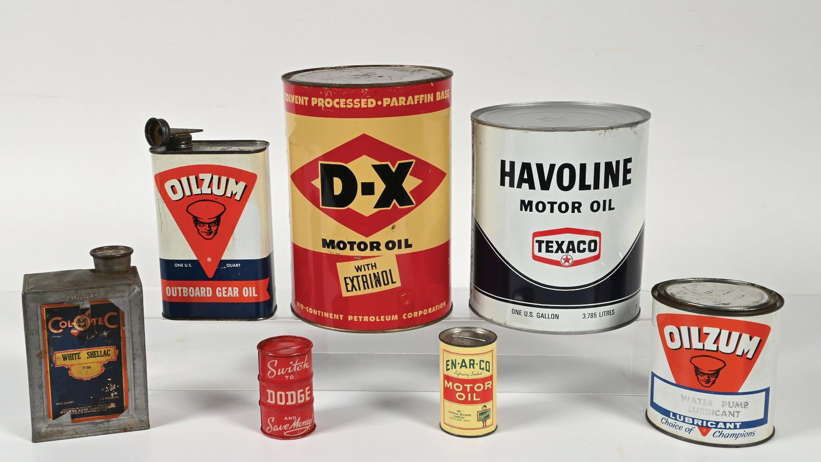COLLECTION OF 7: ASSORTED MOTOR OIL CANS & COIN BANKS. (1 of 2)