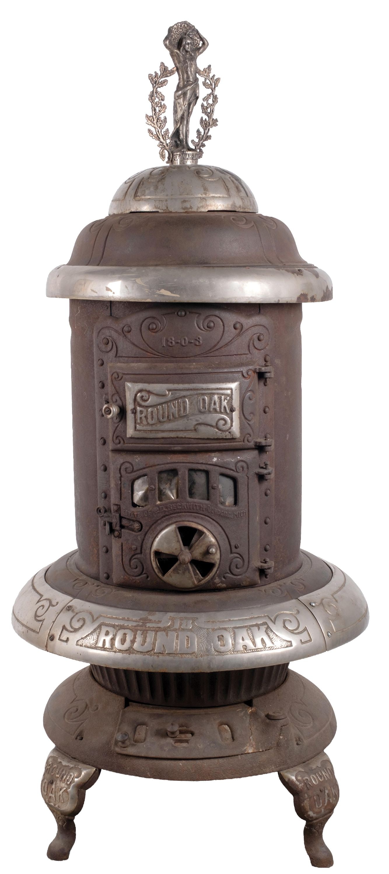ORIGINAL LARGE-SIZE CAST IRON HEATING STOVE: CONDITION: In as-found condition, showing surface rust and oxidation overall. Marked for the Round Oak Manufacturing Company. Doe-Wah-Jack Indian finial makes this a rare version. Desirable heating
