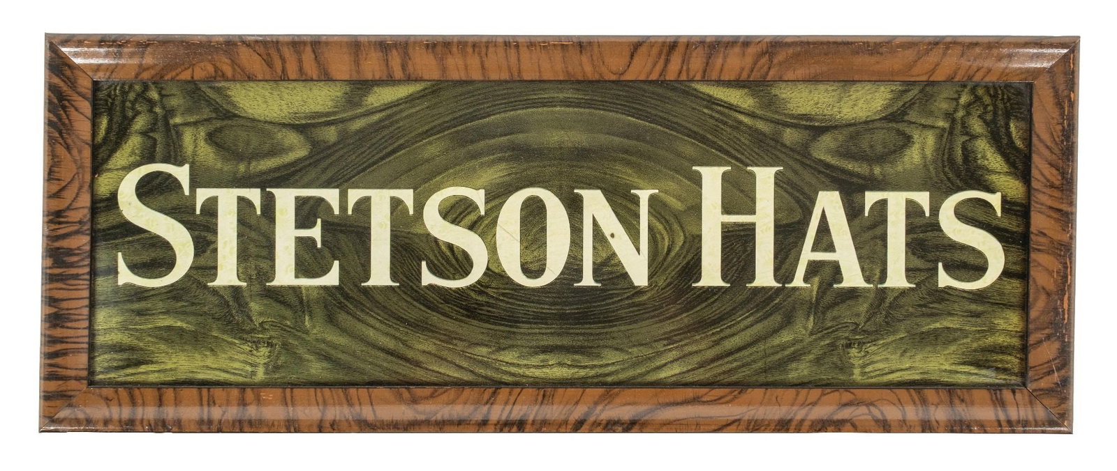 FRAMED TIN STETSON HATS SIGN: CONDITION: Strong color and shine, with some light surface scratches on the interior. Framed in a contemporary frame with the edges out of view. Condition: (8.75). Dimensions: 8 - 3/8" X 21 - 1/4"
