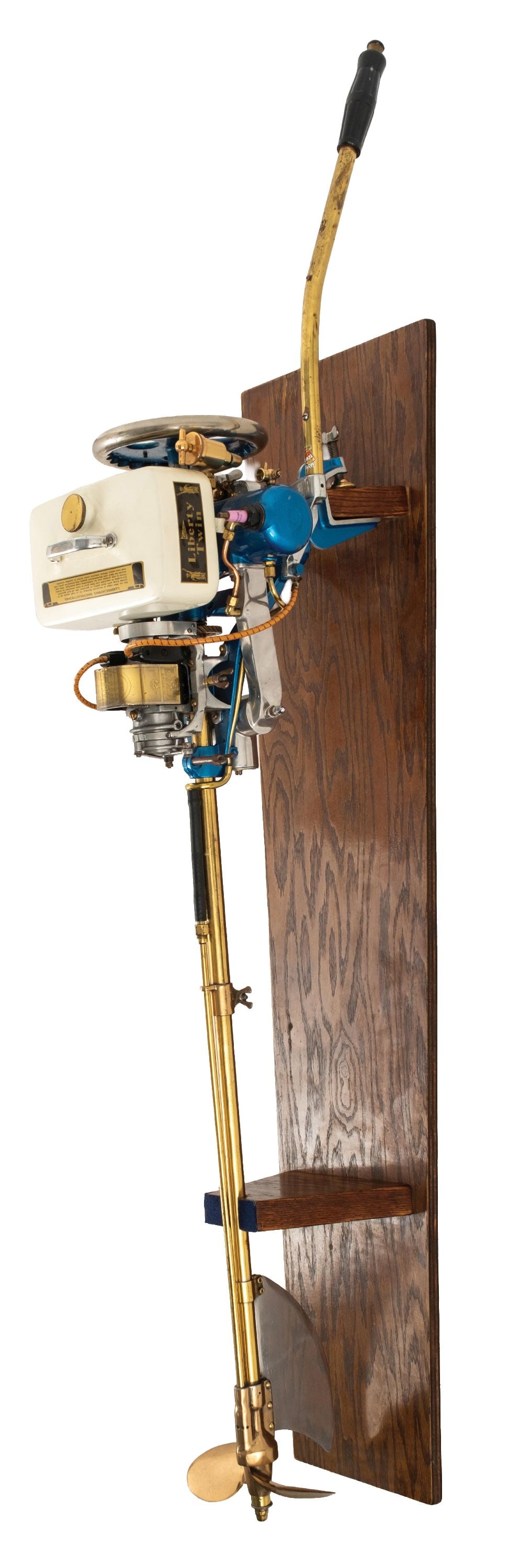 CAILLE LIBERTY TWIN ENGINE OUTBOARD MOTOR: CONDITION: Showing an older restoration with new paint and decals, polished brass and aluminum components, with custom wall display stand. This is not a standard shippable item and will require 3rd pa