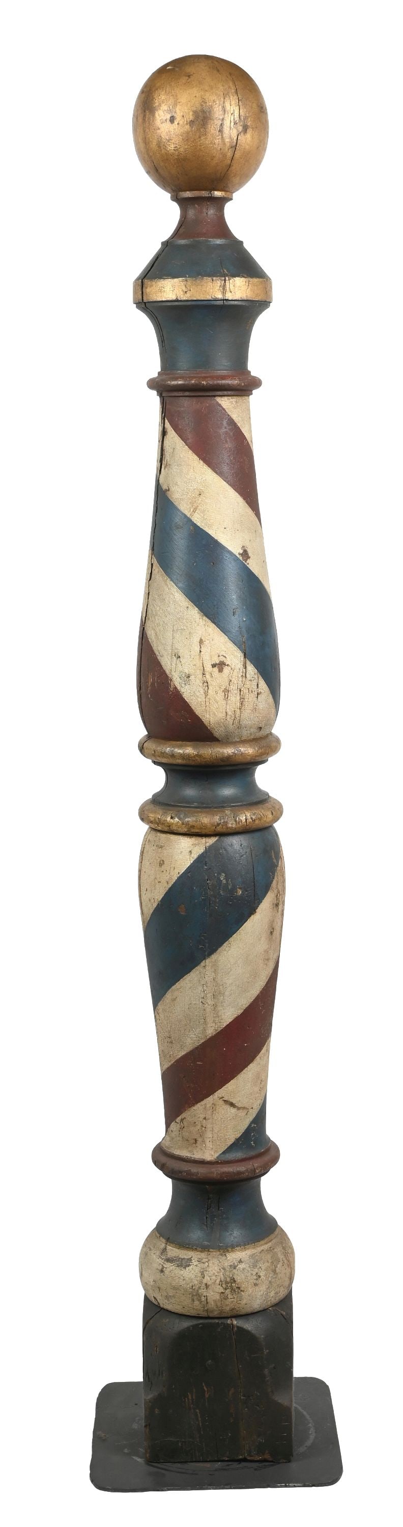 LATE 19TH CENTURY WOODEN BARBER SHOP POLE TRADE SIGN: Circa 1880–1910, American, large turned and painted wooden barber shop trade sign of traditional pole form, featuring a tapered central shaft decorated with spiraling red, blue and cream bands