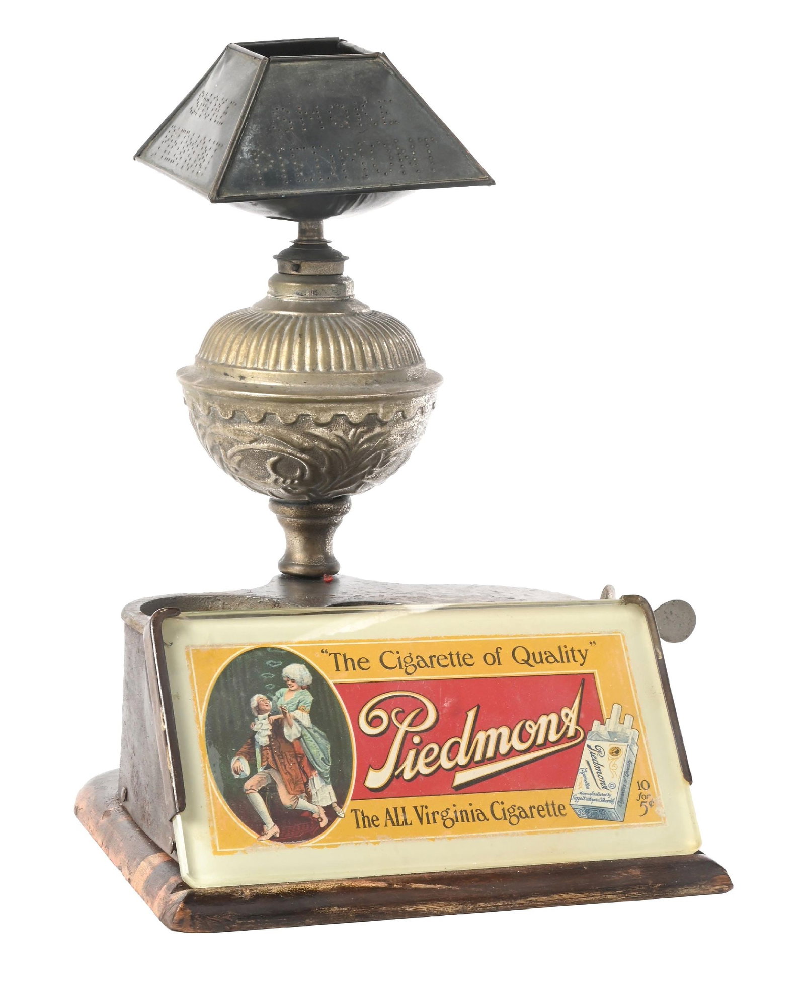 PIEDMONT "THE CIGARETTE OF QUALITY" ADVERTISING CUTTER & LIGHTER COMBO: CONDITION: Showing oxidation and surface rust to the cast iron base. Original front graphic under glass is complete and the oil font is correct for the lighter. The shade is original to the lighter. .